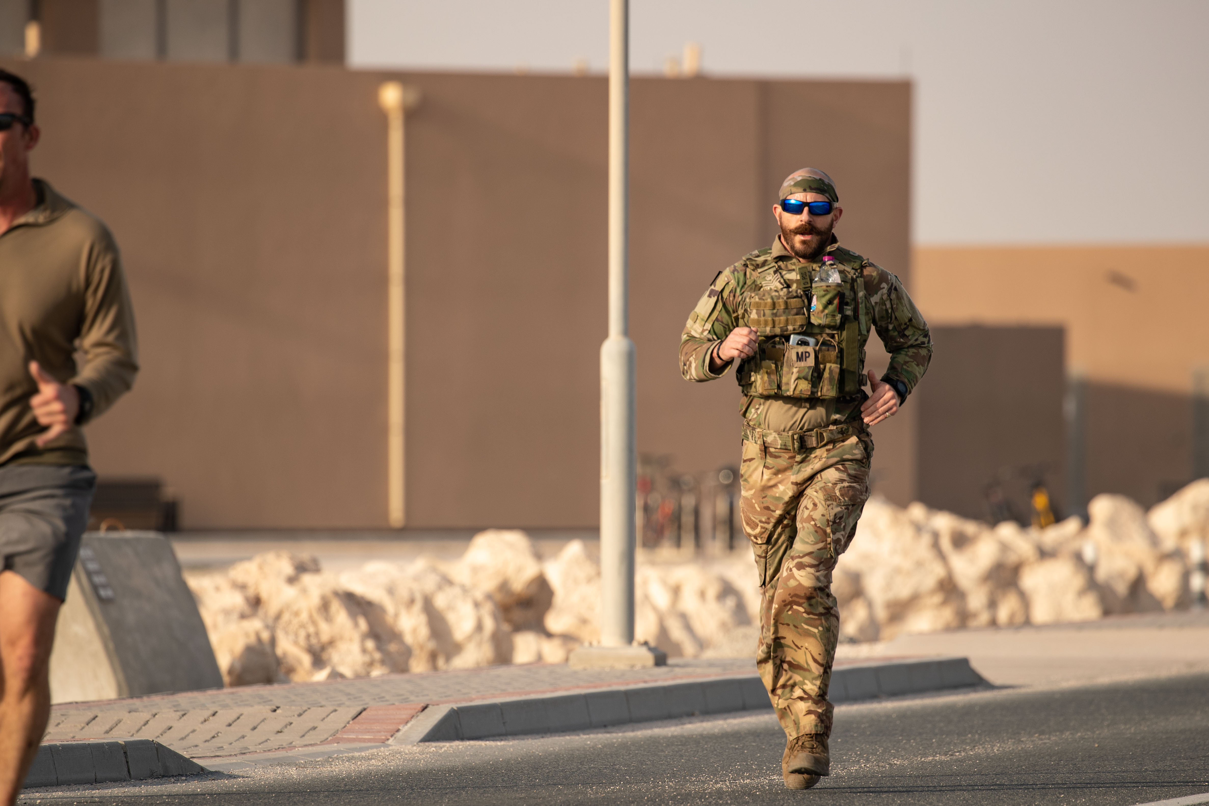 Image shows RAF personnel running in Iraq. 